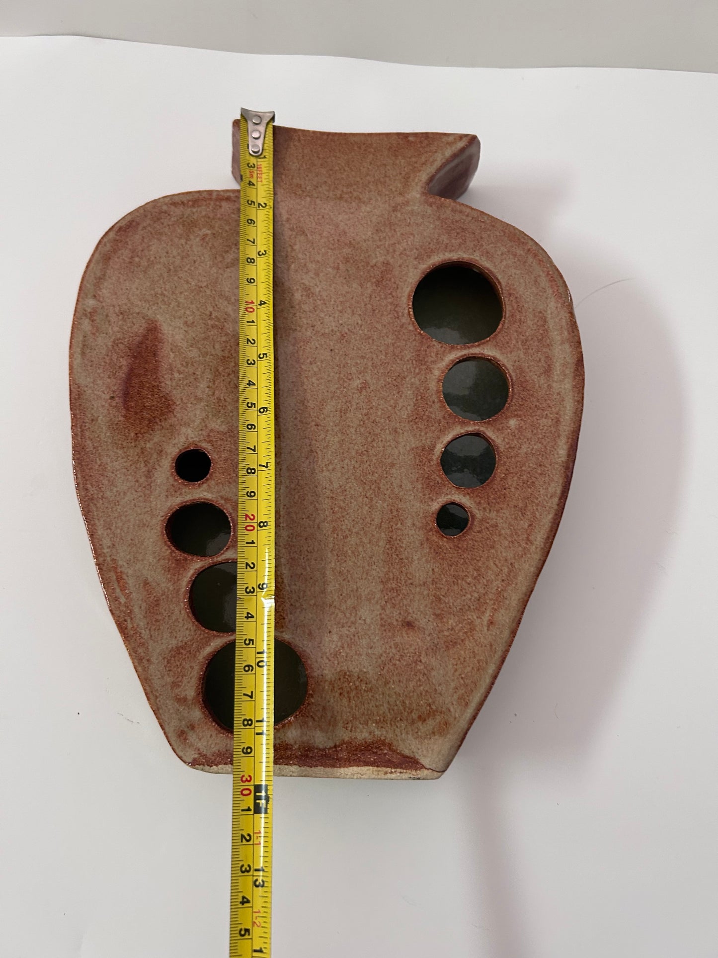 Earthy Ceramic Vase with Circular Cutouts