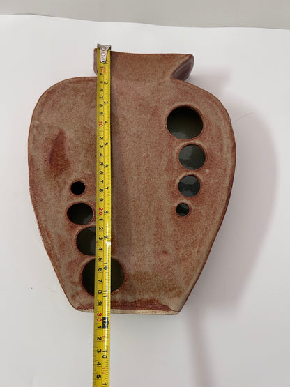 Earthy Ceramic Vase with Circular Cutouts