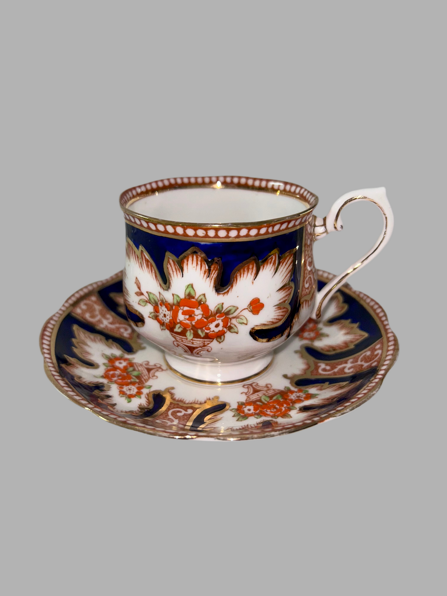 Exquisite Royal Albert "Royalty" Bone China Teacup and Saucer - Cobalt Blue & Orange Floral