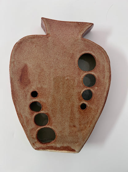 Earthy Ceramic Vase with Circular Cutouts