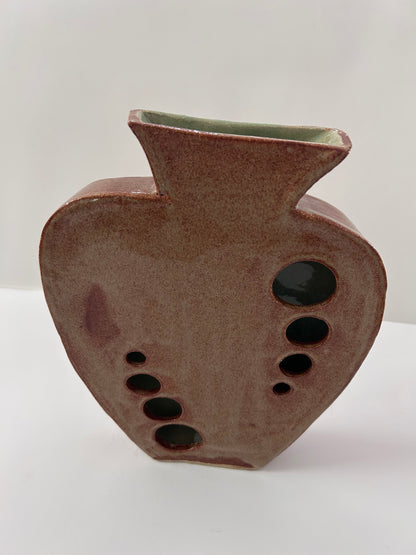 Earthy Ceramic Vase with Circular Cutouts