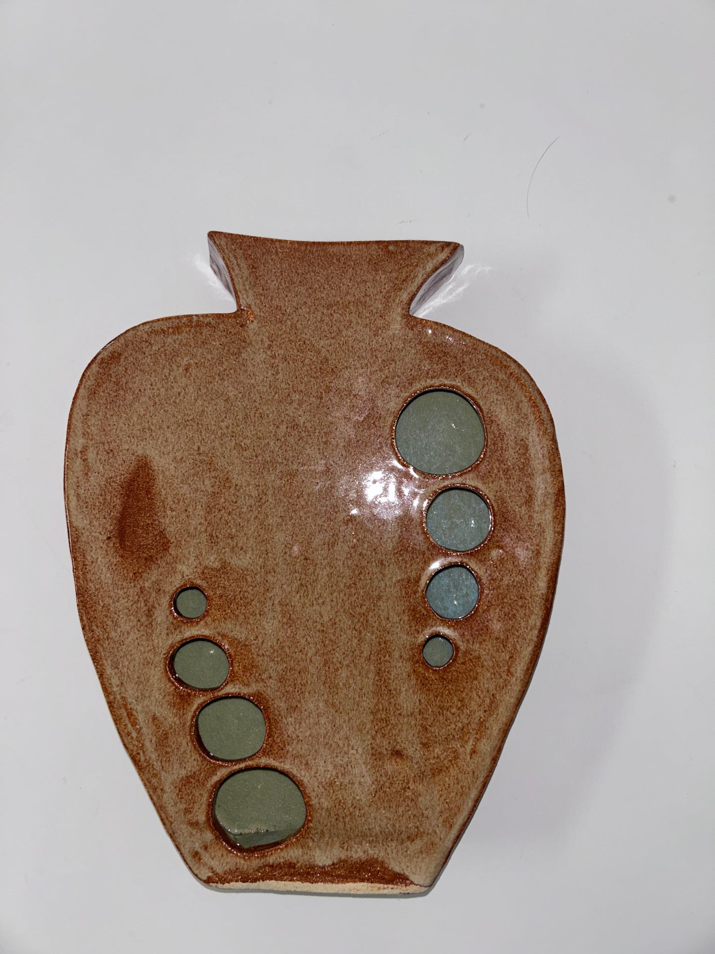 Earthy Ceramic Vase with Circular Cutouts