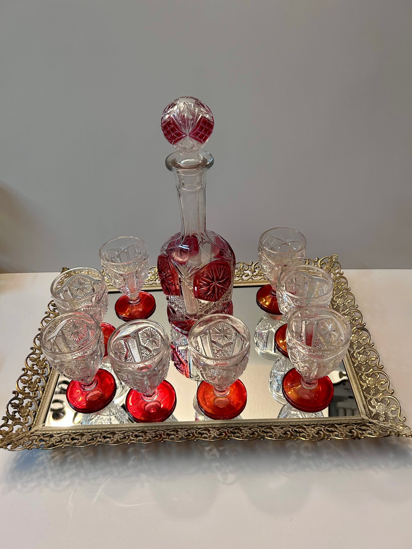 9-Pc Hollywood Regency Ruby Cut-to-Clear Decanter & Ormolu Mirrored Tray Set