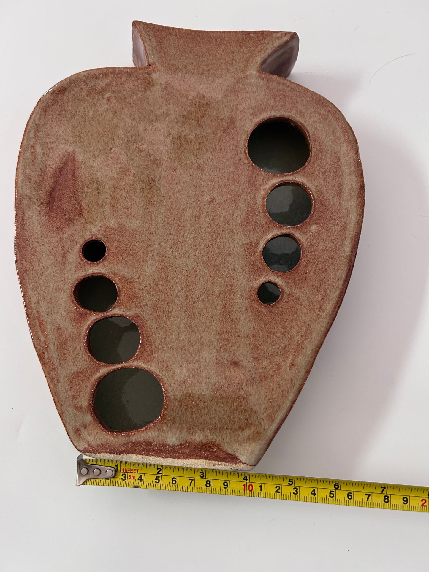 Earthy Ceramic Vase with Circular Cutouts