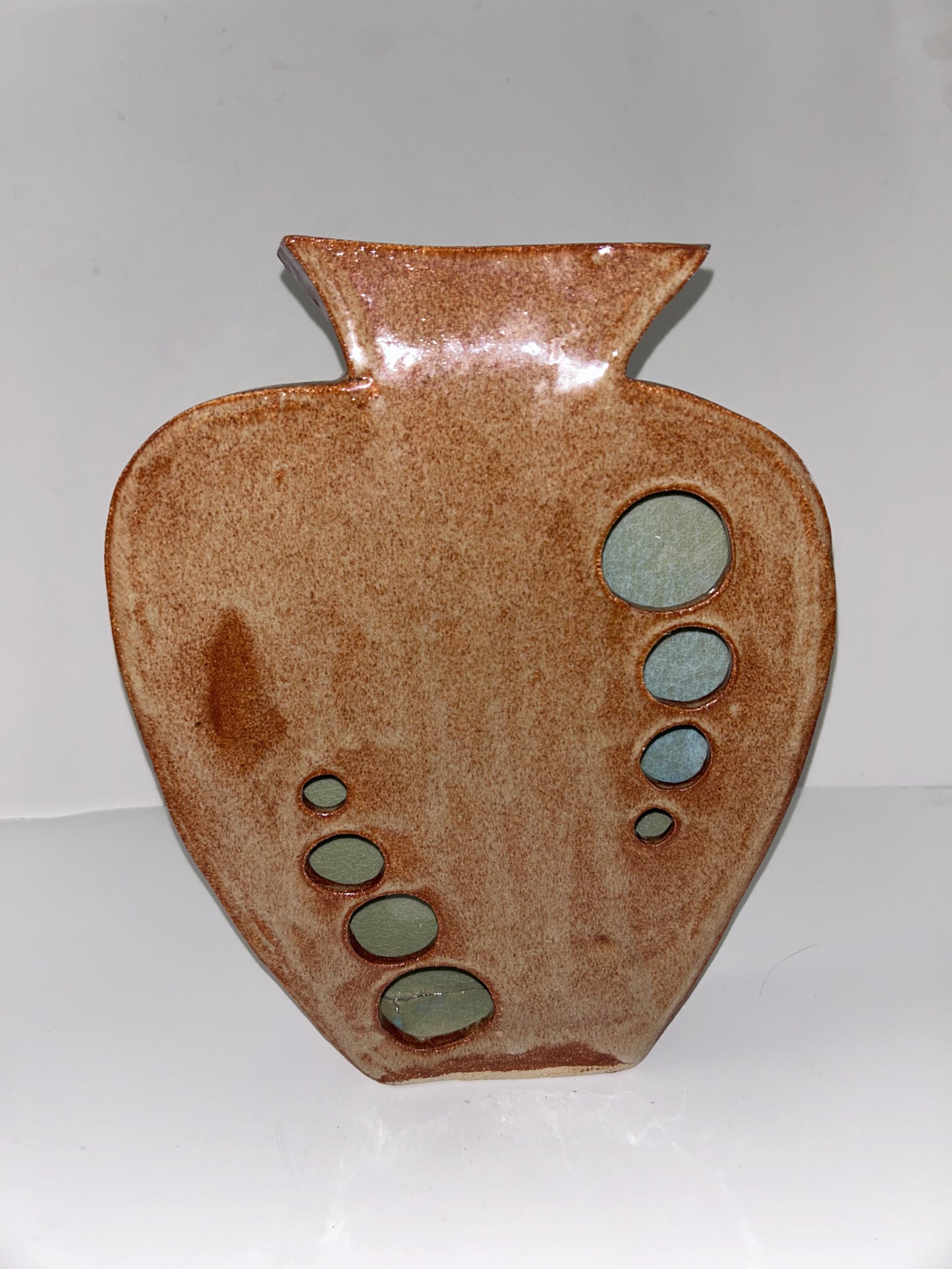 Earthy Ceramic Vase with Circular Cutouts