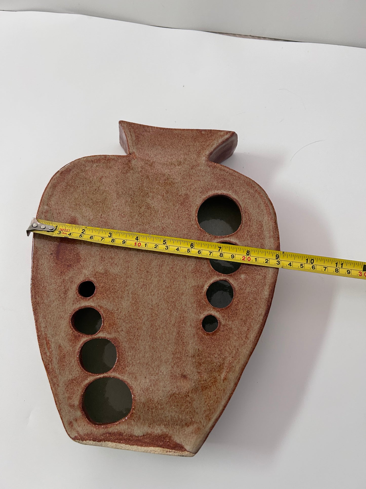 Earthy Ceramic Vase with Circular Cutouts